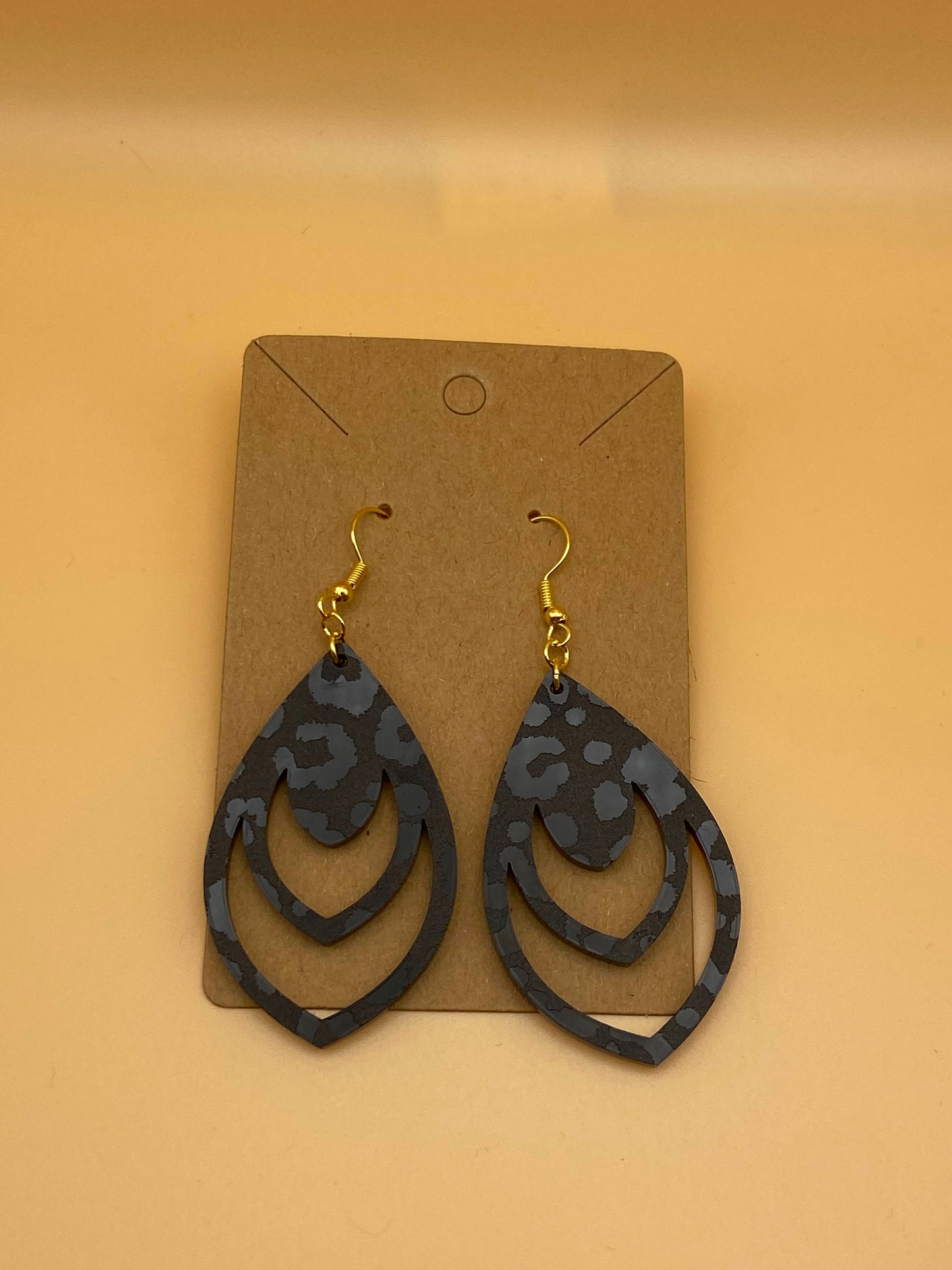 Black Leopard Teardrop with Multiple Cutouts